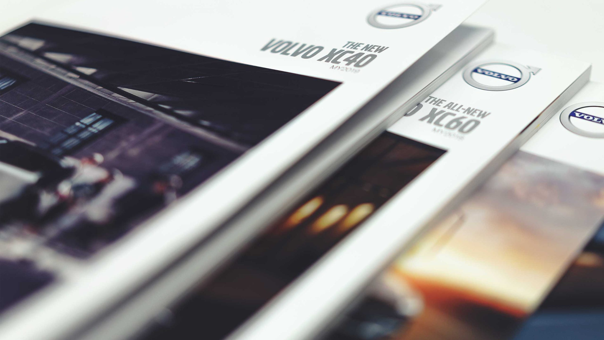 Professionally printed corporate brochure featuring detailed photography and clean editorial layouts.