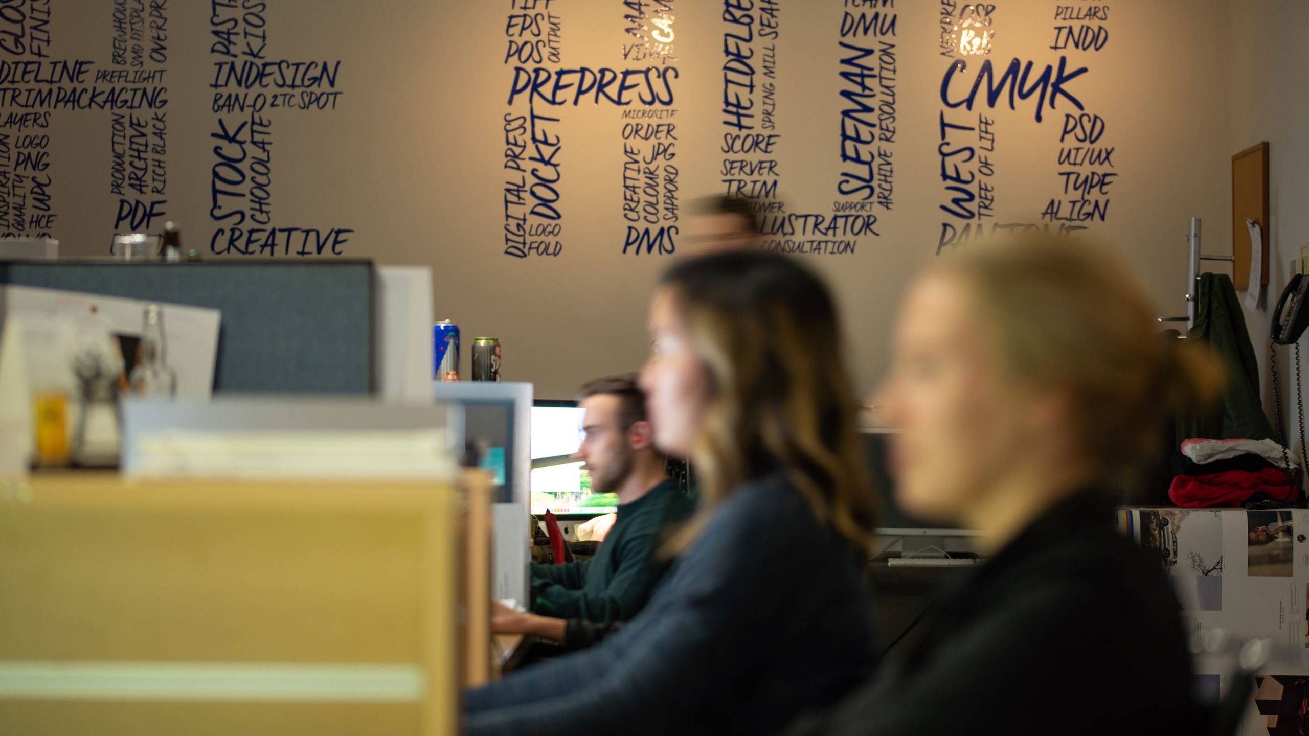 Creative professionals collaborating in an office environment on strategy, design and marketing projects.