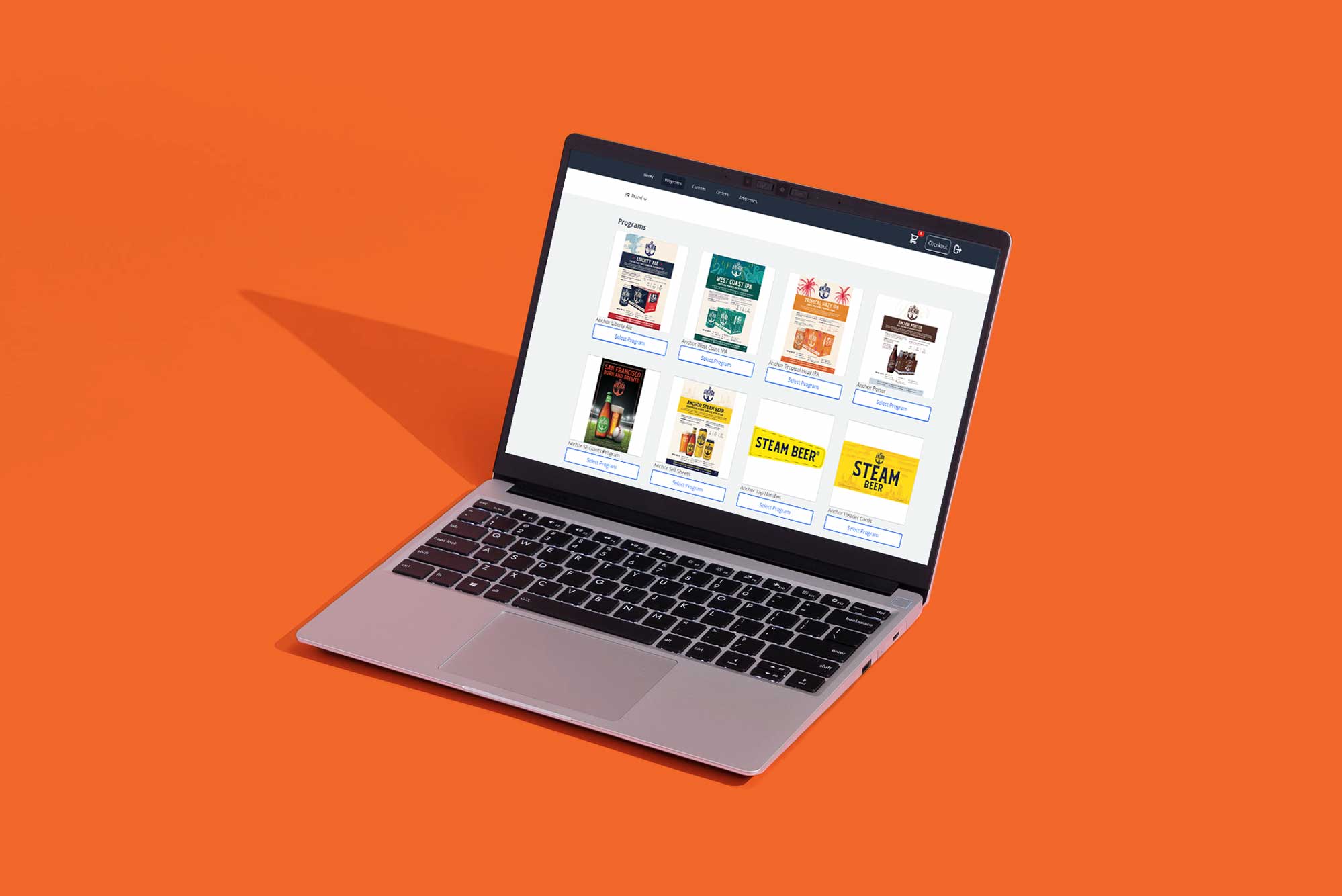 Laptop displaying the Rayment & Collins online printing services platform and digital ordering experience.