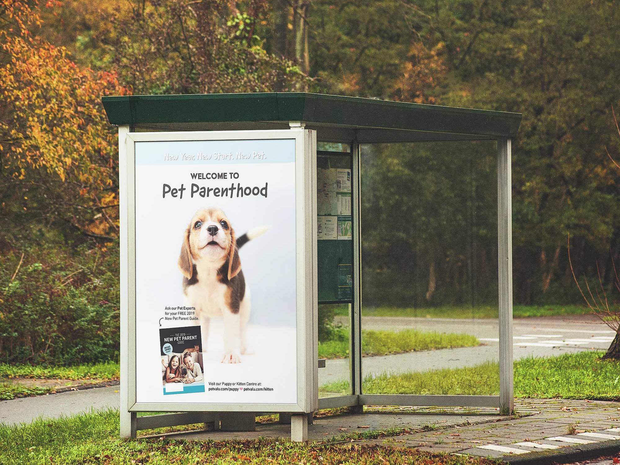 Pet Valu Outdoor shelter advertisement featuring a dog and pet adoption campaign messaging.