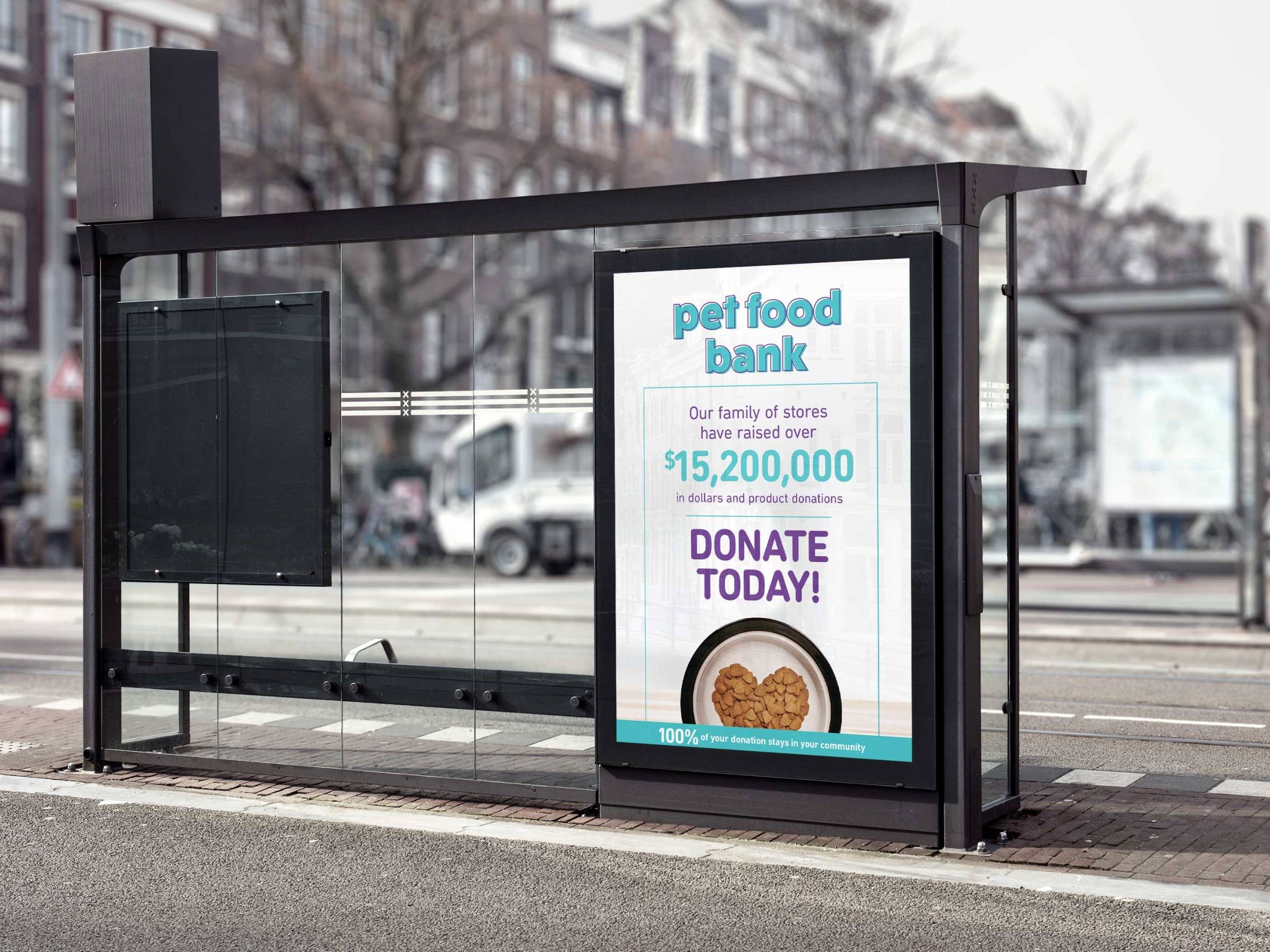 Pet Valu outdoor transit shelter advertisement promoting a pet food bank donation campaign.