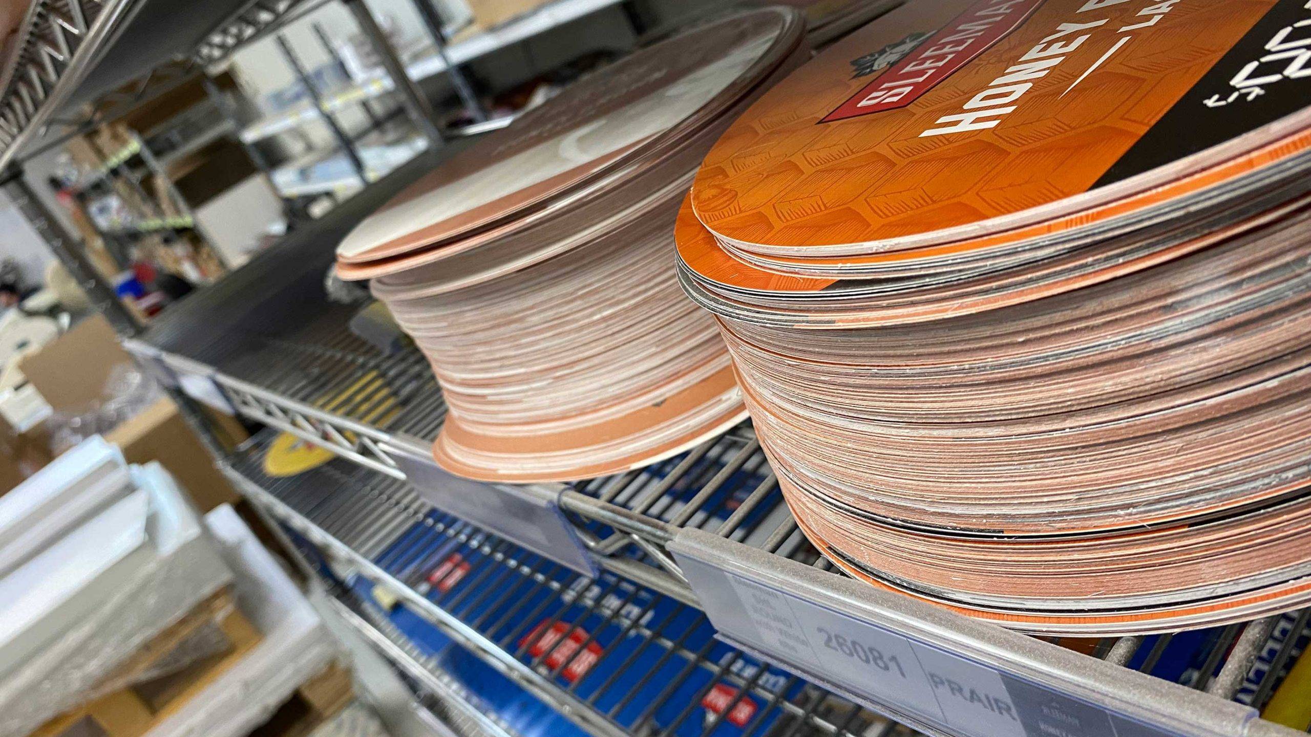 Printed promotional materials being sorted, assembled and prepared for a custom kitting program.