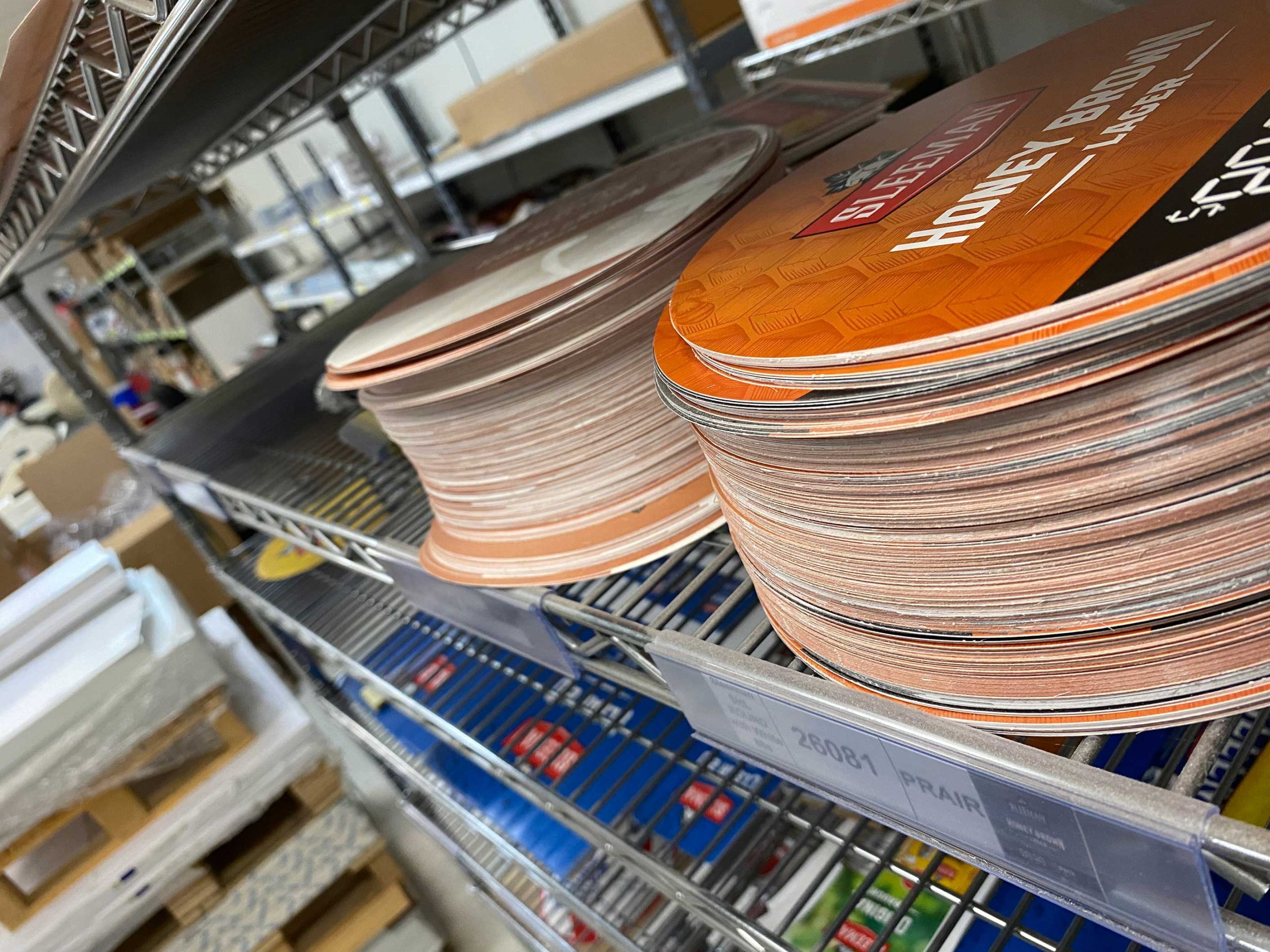 Printed promotional materials being sorted, assembled and prepared for a custom kitting program.