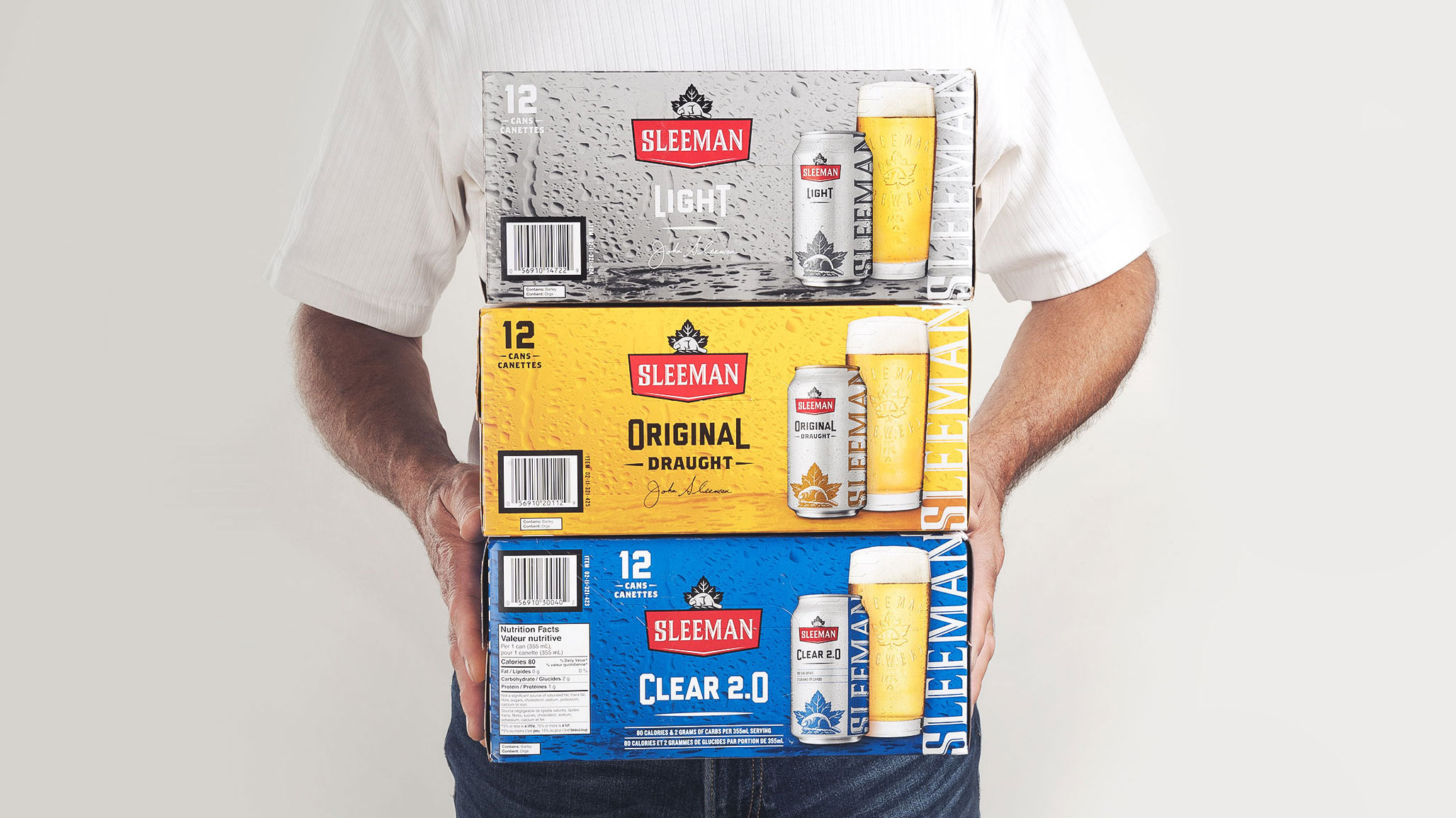 Sleeman branded beverage packaging featuring custom graphics and promotional retail presentation.