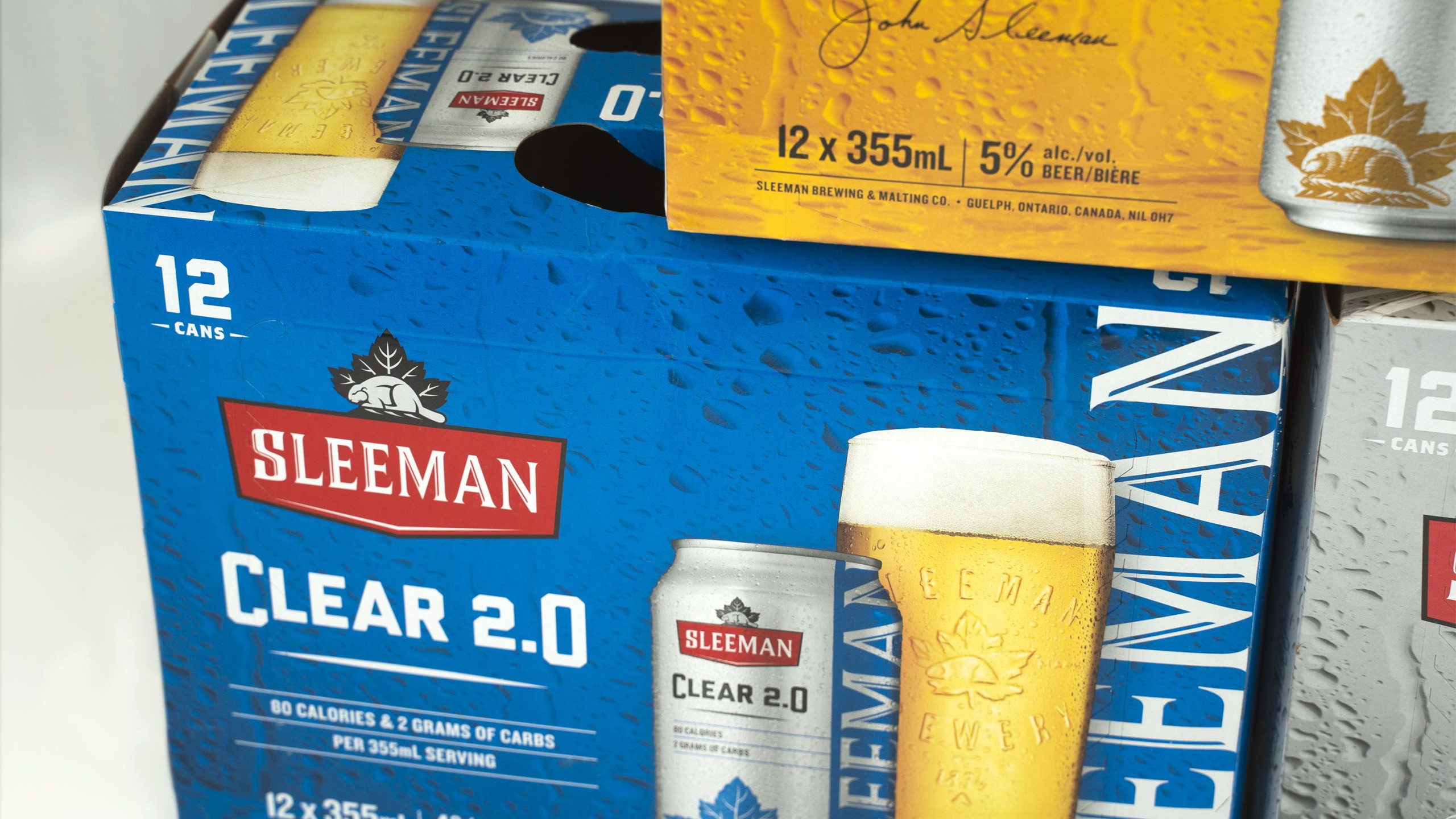 Custom Sleeman beverage packaging featuring branded graphics and retail-focused package design.